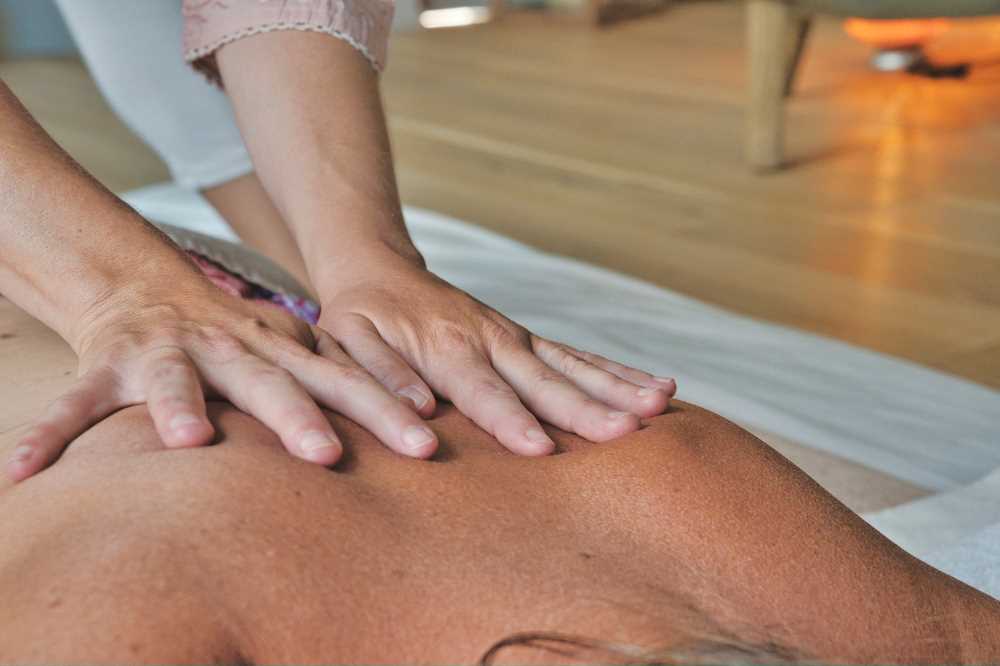 Sports therapy message on a clients back